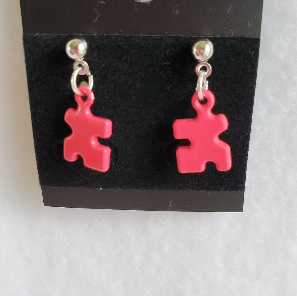 Womens hot pink puzzle piece post earrings